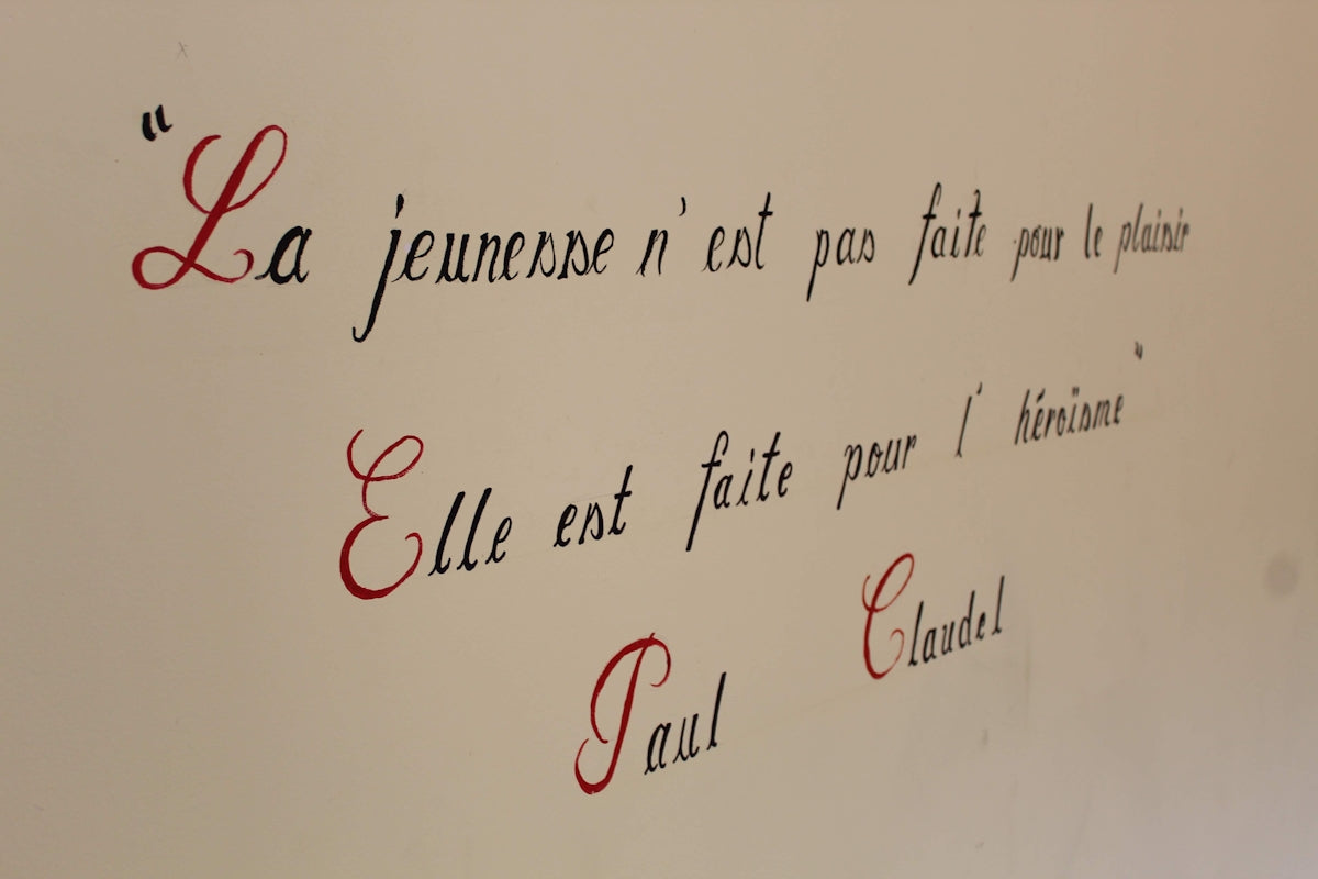 a close up of a writing on a wall