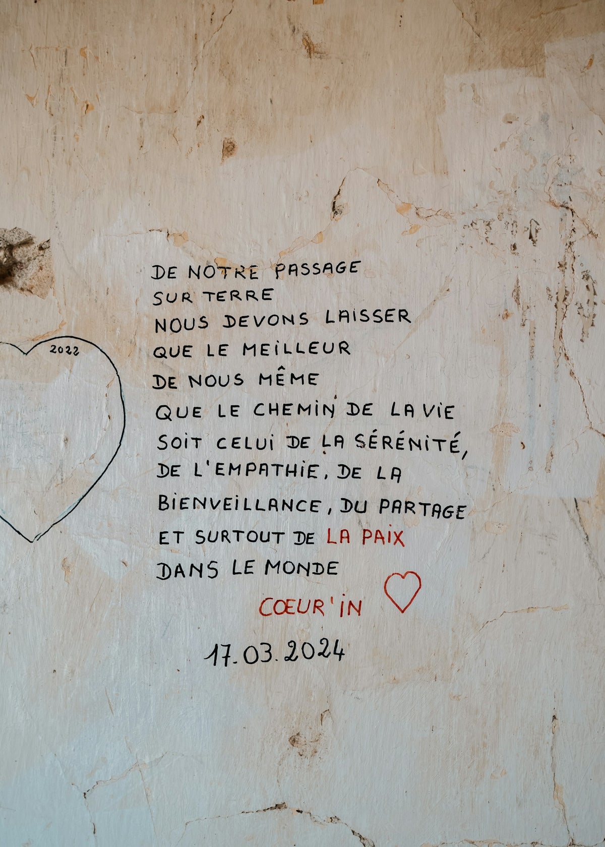 A message written on a wall with a heart